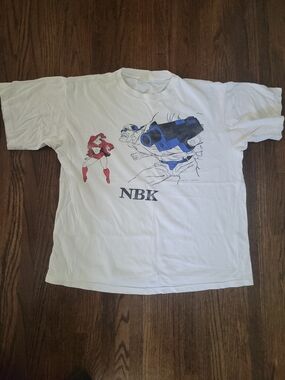 NBK Graphic Tee with Blue Cannon and Red Character